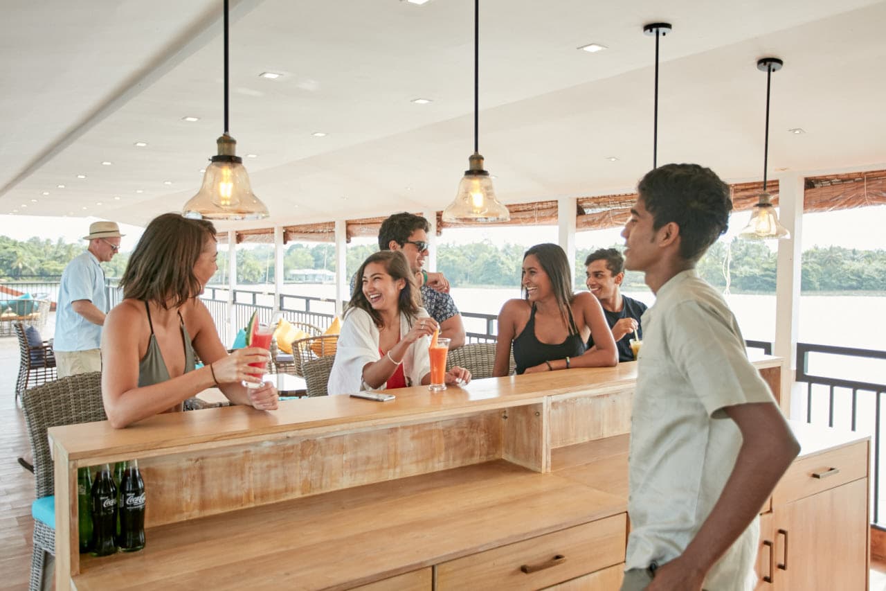 Group of friends enjoying drinks in flow 01 - Charters by Debug Auto Exclusive